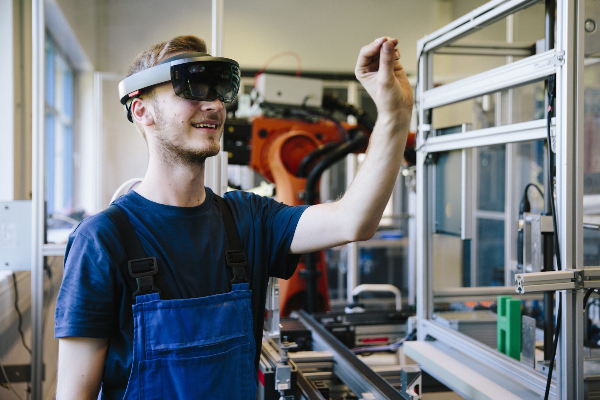 industry 4.0: Young engineer works with a head-mounted display